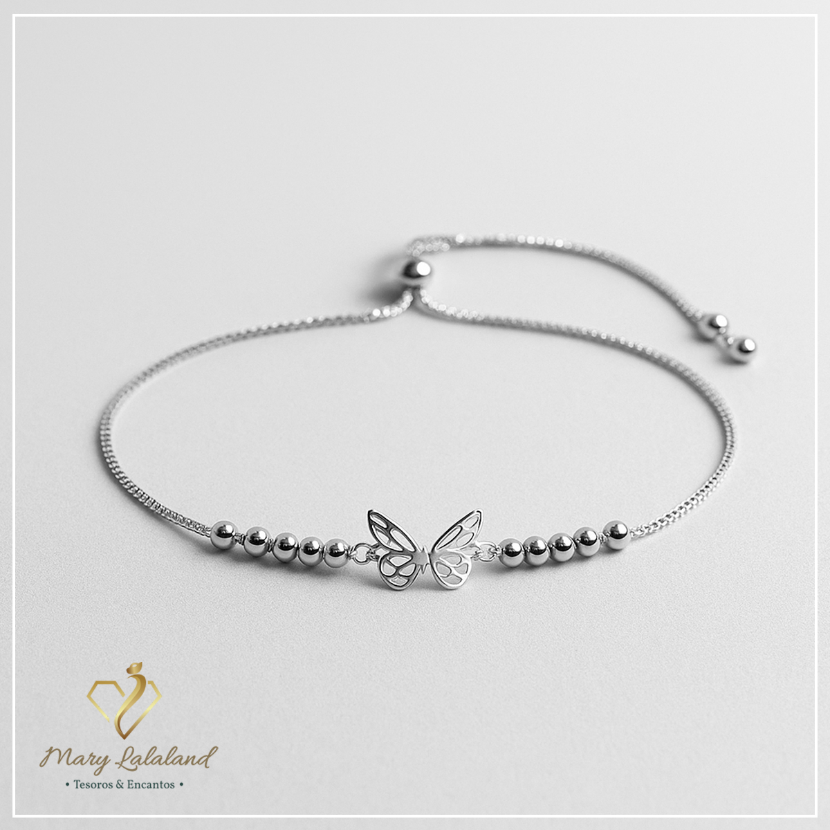PULSERA MARIPOSA CON ESFERAS REGULABLE